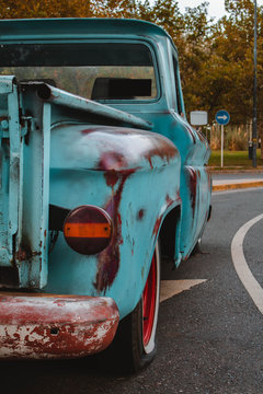 old blue pickup truck on the street. Classic car