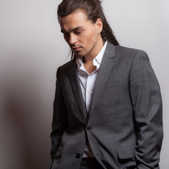 Handsome young elegant man studio portrait.