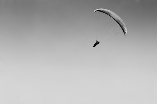 LOW ANGLE VIEW OF Person PARAGLIDING AGAINST SKY