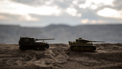 War Concept. Military silhouettes fighting scene on war fog sky background, World War German Tanks...