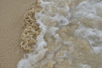 Wave splashing in the sand at Beach west of Havana