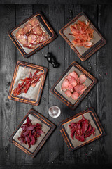 The Best Snacks for beer. Meat chips, dried sliced beef, pork, chicken and horse basturma. Octoberfest party dinner. Festive table with delicious mediterranean food.