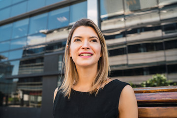 Business woman standing outdoors.