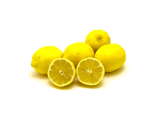 Studio shot pile of organic raw lemons with slice cuts isolated on white