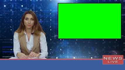 Female news presenter in broadcasting studio with green screen display for mockup usage