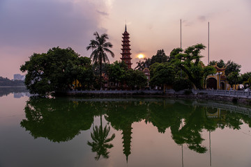 Scenic view at Tran Quoc Pagoda at sunset time, Hano, Vietnam. Tran Quoc Pagoda is the oldest Buddhist temple in Hanoi, located on a small island on West Lake.