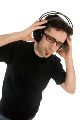 Young man listening to music on headphones