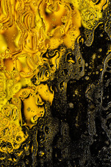 Golden Abstract background. Bubbles of water and oil.