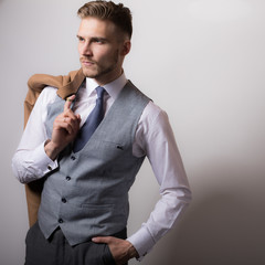 Handsome young elegant man studio portrait.