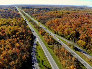 The aerial view of stunning fall foliage near Interstate 81 highway of Watertown, New York, U.S.A