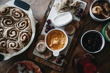 meal on table with cinnamon scrolls