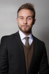 Handsome young elegant man studio portrait.