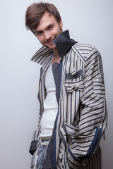 Handsome young elegant man studio portrait.