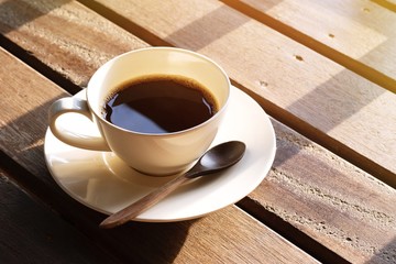 cup of coffee on wooden table