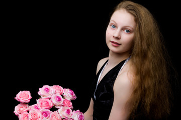 Studio portrait of a beautiful teenager girl of school age with