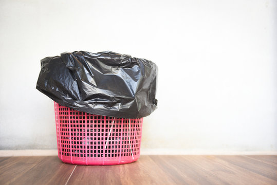 Waste bin , garbage waste and bag plastic black - recycle bin on wall background