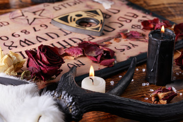 Talking board and planchette, also known as Ouija board, used for communicating with the dead and...