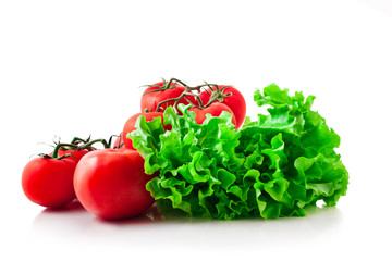 Fresh lettuce and tomatoes isolated on a white background.