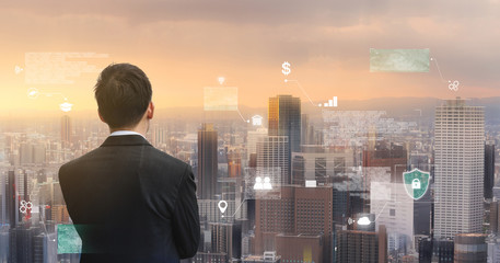 Futuristic augmented reality online data and cyberspace, Businessman looking at the city with futuristic online data hologram