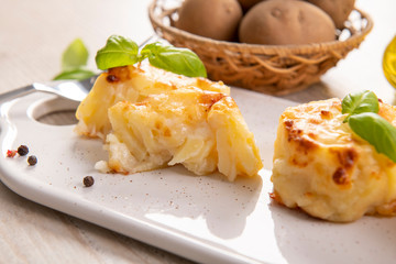 Small casseroles made from potatoes and cheese