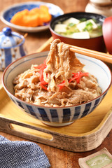 Gyudon - a bowl of rice with sliced beef, onion and sweet sauce.