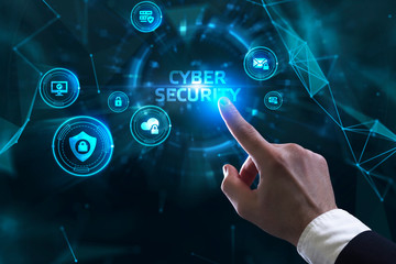 Business, technology, internet and networking concept. Young businessman working  in the office, select the icon Cyber security  on the virtual display.