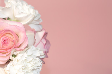 Pink roses and white asters on a pink background.