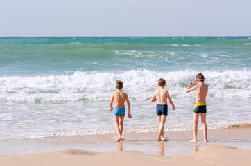 Fototapeta na wymiar Children on the background of the sea