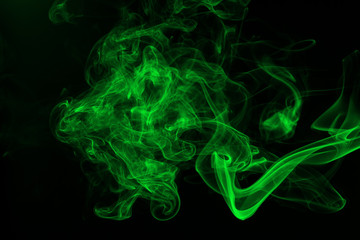 Green smoke abstract on black backgroud for design, darkness concept