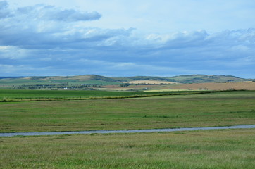 landscape, big open space with green field and blue sky