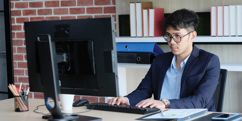 Young asian office man struggle with computer, Frustrated asian business man looking at computer while working at office, Business people struggle with technology, banner