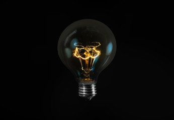 Tungsten light bulb isolated on black background