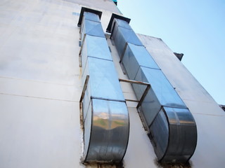 Double ventilation ducts on building walls Made from zinc for extracting fumes from cooking On the...