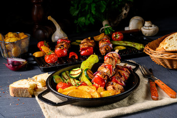 Shish kebab with various vegetables and spice country potatoes