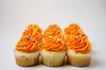 Rows of orange cupcakes