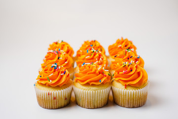 Rows of orange cupcakes