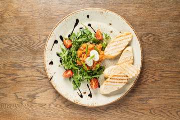 salmon tartar with arugula salad