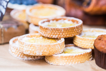 Obraz na płótnie Canvas Street food market concept - Tartlets with cream