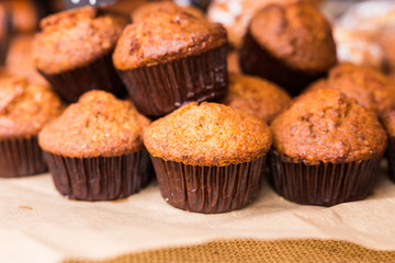 Pastry shop with chocolate cupcakes, close up