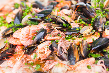 Spanish paella prepared in the street restaurant.