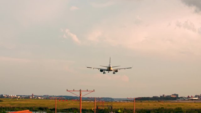 Washington, DC USA - Airport commercial airlines at golden hour. Takeoffs and landings during summertime. Washington DC, Ronald Reagan Washington National Airport DCA. Travel flight