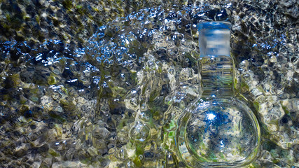 Glass flask with clear water.