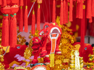 chinese traditional dancing lion hanging for New Year,calligraphy translation:good bless for money