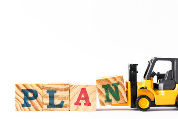 Toy forklift hold wood letter block n to complete word plan on white background