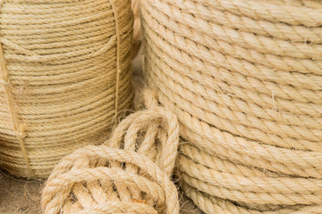 Close up view of twisted rope made of sisal. Background - obrazy, fototapety, plakaty
