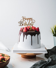 Happy birthday fresh fruit cake with Chocolate Happy birthday on cake concept with strawberry kiwi...
