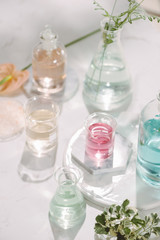 Composition with essential oils and flowers on table