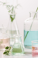 Bottles with different perfume oils on table