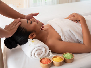 Asian girls are a relaxing facial massage in the Spa Salon. Thai massage for health