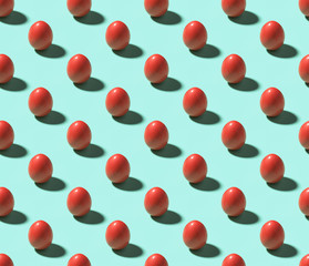 Red easter eggs on cyan isometric seamless background